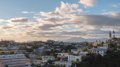 Colorful sunset and cloudscape over the Oceania city of Noumea, New Caledonia - Day-to-night time lapse
