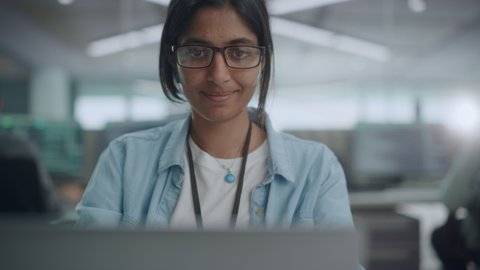 Diverse Office: Portrait of Beautiful Indian IT Programmer Working on Desktop Computer. Empowered Female Software Engineer Creating Innovative App, Program, Video Game in Friendly Environment