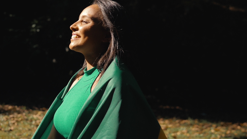 Black woman with Brazilian flag, independence day