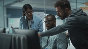 Diverse Group of Energetic Professionals Meeting in Modern Office: Brainstorming IT Programmers Use Computer Together, Talk Strategy, Discuss Analysis. Software Engineers Develop App Program - Powered by Shutterstock - Get 15% off with code: PIKWIZARD15