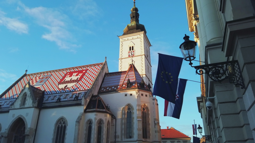 Croatian and European flags waving in front of St. Marco church Zagreb Royalty-Free Stock Footage #1078079444