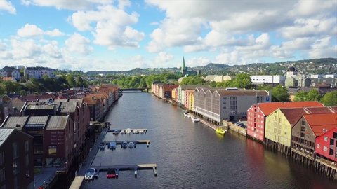 Trondheim, Norway - August 02, 2017: Colorful old houses at the Nidelva river embankment aerial view in the center of Trondheim town in Norway