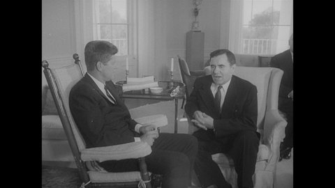 1960s: President John F. Kennedy on rocking chair speaking with Soviet Foreign Minister Andrei Gromyko. Kennedy delivering speech.