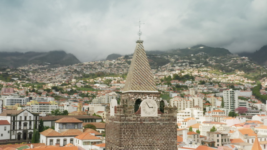 Madeira Islands, Portugal. Picturesque landscape with volcanic mountains under cloudy sky. Aerial footage of the dense, ancient settlement within remote island. High quality 4k footage