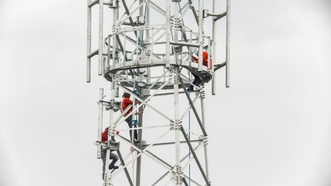 Technician Installing Telecommunication Tower of 4G and 5G cellular.