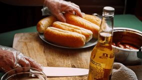 Cut the bread for the hot dog. 4k homemade video