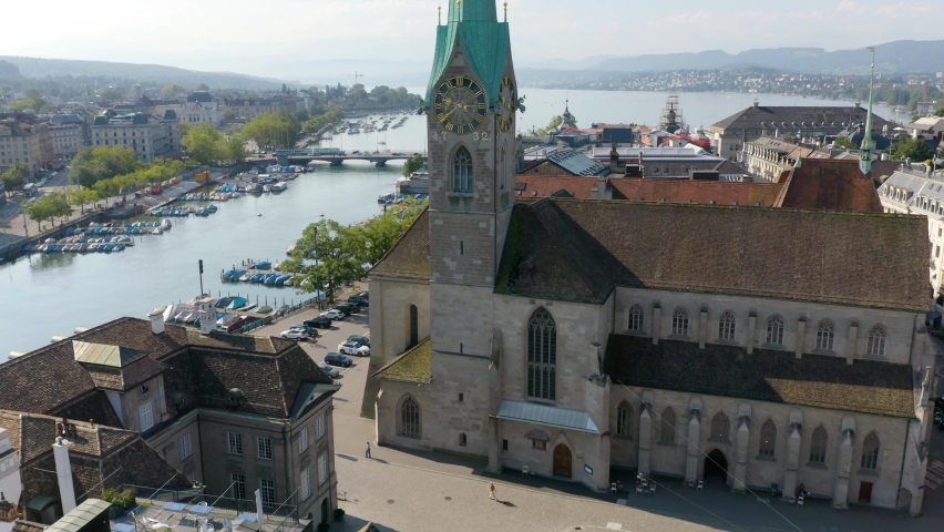 Aerial Establishing Shot of Fraumünster Church with Limmat River and Lake Zurich in Background