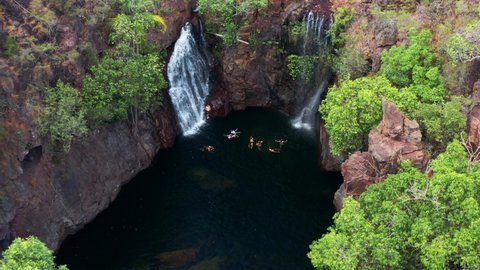 Tourists On The Plunge Pool Of Florence Falls In Litchfield National Park In Australia. aerial