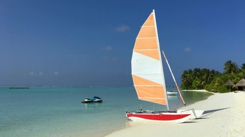 Maldives sun island Shore boat with sail