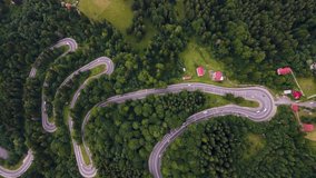 Overhead 4K drone clip over a winding road on the mountainous area of Busteni,Transylvania, Romania