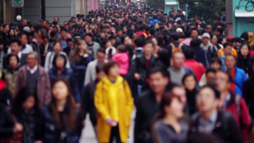Busy pedestrian street of Chinese city, blurred view on crowd of walking people. Popular shopping and touristic area, Nanjing road in Shanghai at day time, alley full of unrecognizable people Royalty-Free Stock Footage #1078137311
