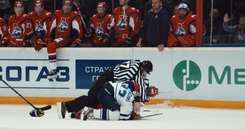 YAROSLAVL, RUSSIA - OCTOBER 3, 2015: hockey KHL GAME Lokomotiv Yaroslavl - Dinamo Moscow a dynamic fight of hockey players after powerful sily attack 4K October 3, 2015 in Yaroslavl, RUSSIA.