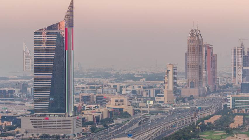 Aerial view of Sheikh Zayed Road in Dubai Internet City area day to night timelapse