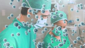 Animation of covid 19 virus cells over surgeons in operating theatre. global covid 19 pandemic concept digitally generated video.