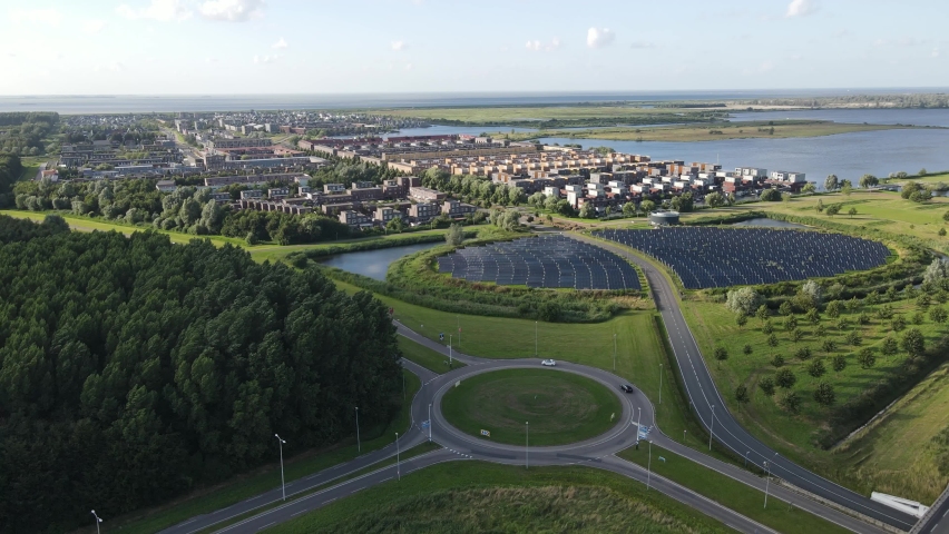 Modern innovative residential area in Almere, along the waterside, including solar panel field. The Netherlands, Flevoland.