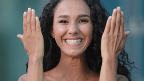 Female portrait outdoors hispanic young emotional girl brunette lady playful woman covers hands with palms face hides doing grimaces plays hide and seek changes emotions smiles toothy makes kiss - Powered by Shutterstock - Get 15% off with code: PIKWIZARD15