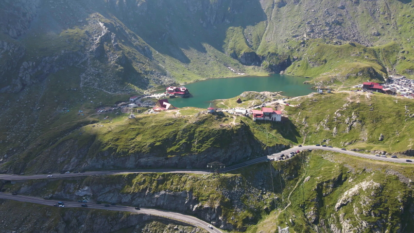 Aerial jib up of beautiful Bâlea lake in the mountains near Transfagarasan Road, Romania