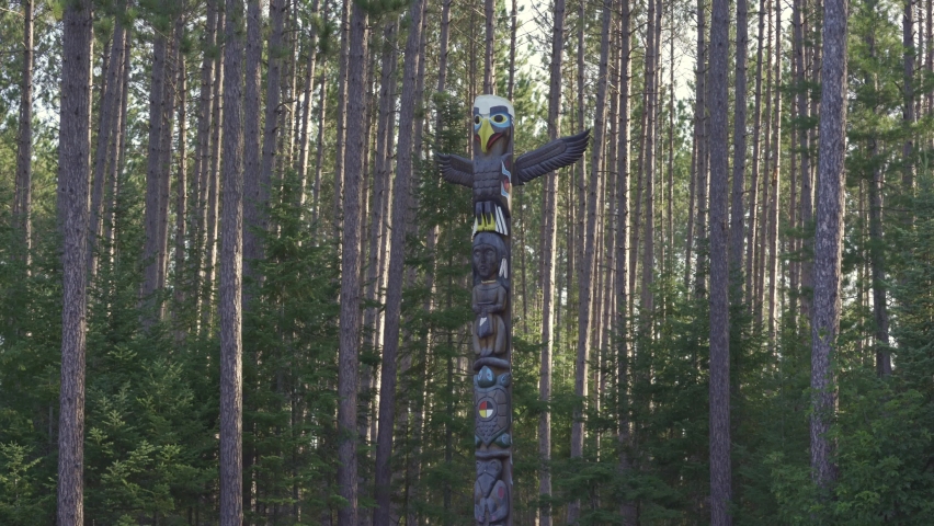 A Indigenous Totem Pole Stands Amongst A Forest, Algonquin Provincial Park