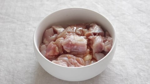 Chinese cooking, adding corn starch in chicken meat for seasoning prepared for stir fried