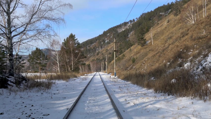 Many footprints on the snow of the railway track, Circum-Baikal Railway. Lake Baikal, various snow and ice landscapes. Irkutsk Oblast, Russia. Jan. 2019.