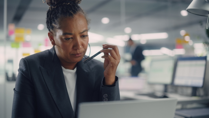 Busy African American Female Manager Using Computer in Modern Office. Overworked Tired Employee Dealing with Hard Work Tasks. Stressed Beautiful Woman Exhausted to Come Up with New Business Ideas. Royalty-Free Stock Footage #1078185089