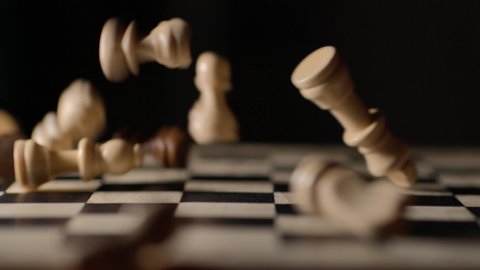 Game of Chess. Chess Pieces Falling Onto Board. Destruction Ideas. War Development Analysis Strategy Plan, Leader and Teamwork Concept for Success. Business Solutions, Success Strategy.