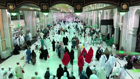  MAKKAH, SAUDI ARABIA - December 12, 2020: Group of Muslim worshipers perform the saie or saei (brisk walking) starting from Safa to Marwah mountain, as one of the umrah and hajj 