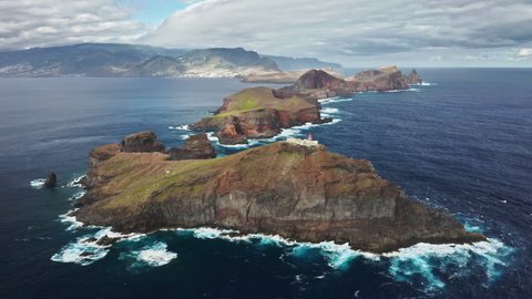 Lighthouse Farol da Ponta de Sao Lourenco, Madeira Islands, Portugal. Aerial footage of a beautiful landmark off the cape. Spectacular harmony between coast and mountains. High quality 4k footage