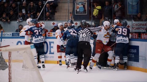 NOVGOROD, RUSSIA - FEBRUARY 25, 2016: hockey game KHL Playoff Torpedo - Jokerit fight. Professional popular winter tournament, man player league Stadium player score goal