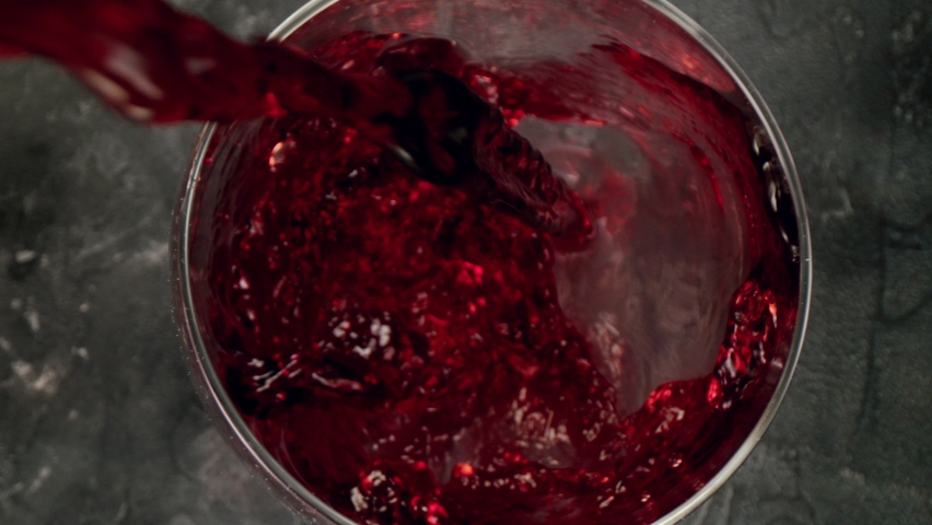 Super slow motion of pouring red wine into glass with camera motion. Unique angle with underwater macro lens.  Speed ramp effect. Filmed on high speed cinema camera, 1000 fps. | Shutterstock HD Video #1078212674