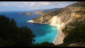 Aerial drone video of iconic turquoise and sapphire bay and beach of Myrtos, Kefalonia (Cephalonia) island, Ionian, Greece. Myrtos beach, Kefalonia island, Greece. Beautiful view of Myrtos beach.