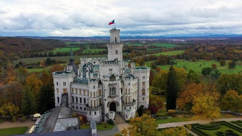Drone view of medieval castle in Hluboka nad Vltavou, Czech Republic. Castle Hluboka nad Vltavou is one of the most beautiful castles in Czech Republic. Hluboka nad Vltavou in autumn with red foliage
