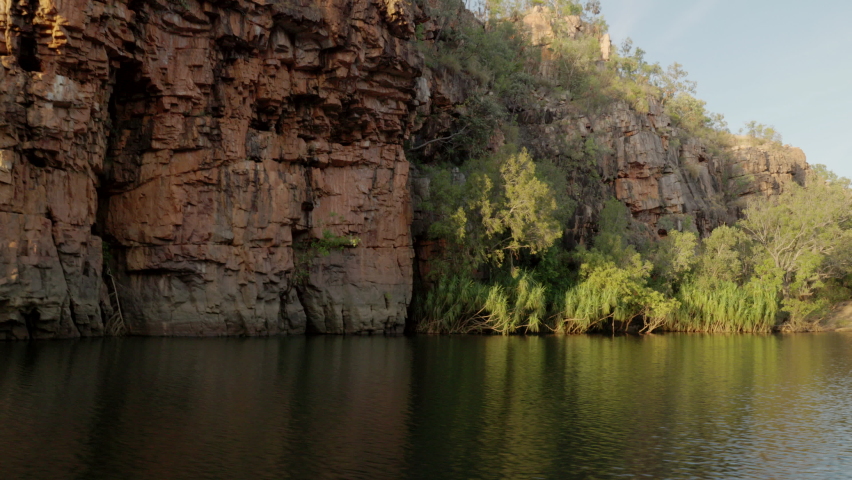 view during sunrise cruise of nitmiluk gorge, also known as katherine gorge at nitmiluk national park in the northern territory while facing downstream Royalty-Free Stock Footage #1078218374