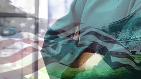 Animation of flag of usa waving over surgeons in face masks. global covid 19 pandemic and healthcare services concept digitally generated video.