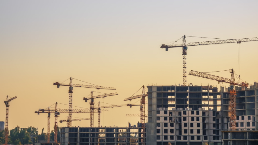 Lots of Cranes at the Evening Construction. Time Lapse