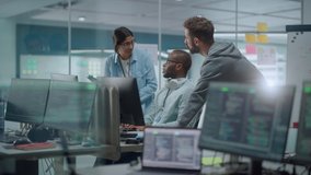 Diverse Group of Professionals Meeting in Modern Office: IT Programmers Use Computer, Talk Strategy, Discuss Planning. Specialists Create Innovative Software. Slow Motion Static Wide - Powered by Shutterstock - Get 15% off with code: PIKWIZARD15