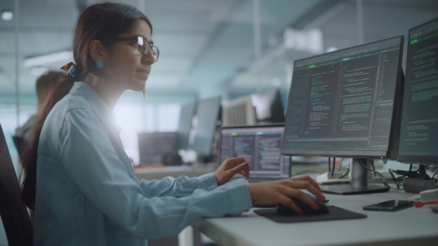 Diverse Office: Enthusiastic Indian IT Programmer Working on Desktop Computer. Female Specialist Creating Innovative Software. Engineer Developing App, Program, Video Game. Writing Code in Terminal | Shutterstock HD Video #1078231859