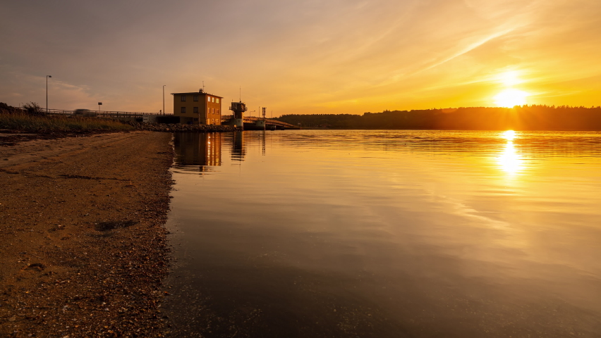 Time Lapse clip of a sunset at Kronprins Frederiks bridge in Frederikssund, Denmark with ships passing