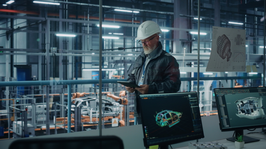 Car Factory Office: Portrait of Male Engineer Wearing Hard Hat Walking, Monitoring Production Conveyor with Tablet Computer. Automated Robot Arm Assembly Line Manufacturing High-Tech Electric Vehicles | Shutterstock HD Video #1078237964