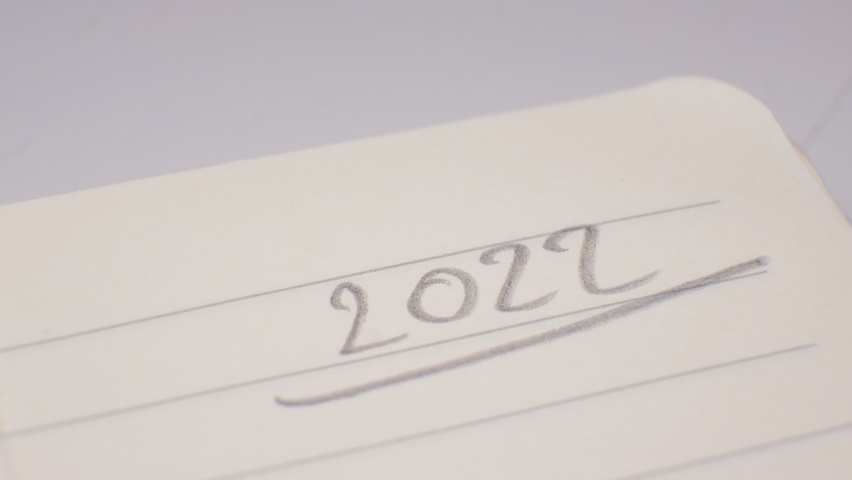 2022 Year Date Hand Writing with Mechanical Pencil in Single Line Notebook Page Corner | Shutterstock HD Video #1078246637