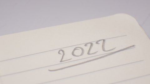2022 Year Date Hand Writing with Mechanical Pencil in Single Line Notebook Page Corner