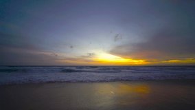 Nature video sunset The scenery, beaches, natural beauty and wonders.  sunset in the sea  On a beautiful day, the sky is golden yellow  and the sea waves wash on the beautiful soft sandy beach