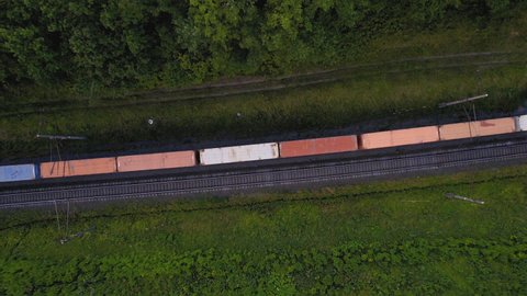 Cargo Containers Transportation On Freight Train By Railway. Intermodal Container On Train Car. Rail Freight Container Shipping. Logistics Concept on railroad. Import - export goods from Сhina.
