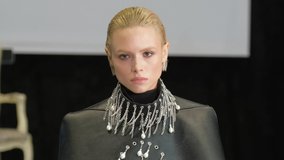 Beautiful female model walking down runway podium. Women on fashionable expo week. Haute couture catwalk, elegant people vogue. Beauty girl catwalks on fashion show stage, delicate person defile look. - Powered by Shutterstock - Get 15% off with code: PIKWIZARD15