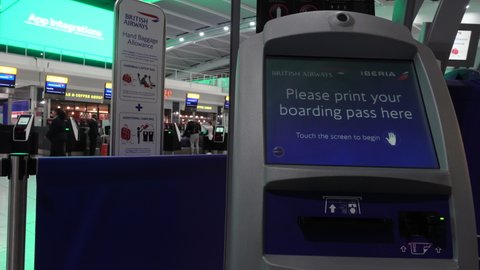 HEATHROW AIRPORT, LONDON, ENGLAND – 16 JANUARY 2019: 4K video clip of British Airways passenger self check in screen at Terminal Five, Heathrow Airport, London, England
