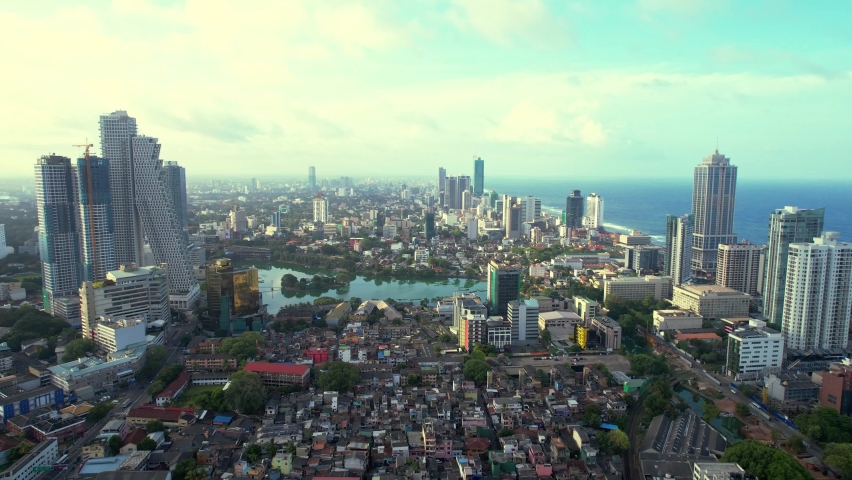 Aerial view of the Colombo, Sri Lanka. Cityscape, the Blue sky and Sea are in Background. Galle Face, Colombo, Sri Lanka. UHD Video. 