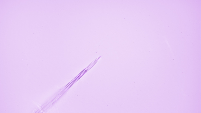 Fluid is injected from syringe creating bubbles and circles on water surface on pale purple background | Macro shot of skincare cosmetics ingredients for its commercial - Powered by Shutterstock - Get 15% off with code: PIKWIZARD15