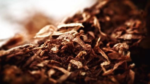 Hand rolling Tobacco extreme close up stock footage