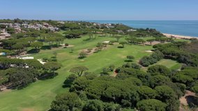 Aerial video shooting of a tourist village on the Atlantic Ocean, with golf courses, Vale de Lobo. Portugal Algarve.
