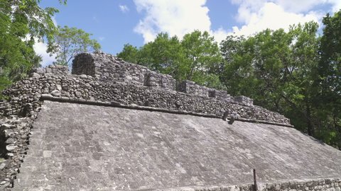 COBA, MEXICO - CIRCA 2021: Ruins of "pok-ta-pok" sport court in ancient Mayan city of Coba. Panning shot.